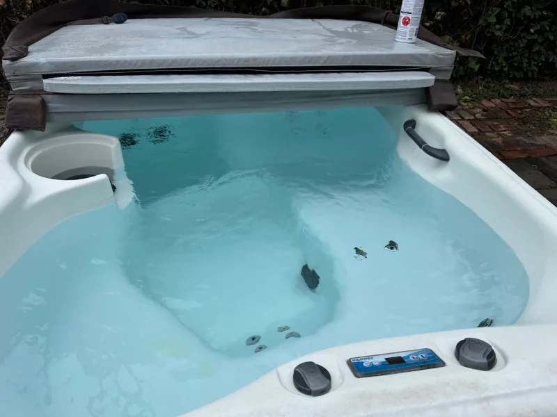 Spa cleaning in Lake Havasu City: JM Pool Service tech servicing a hot tub