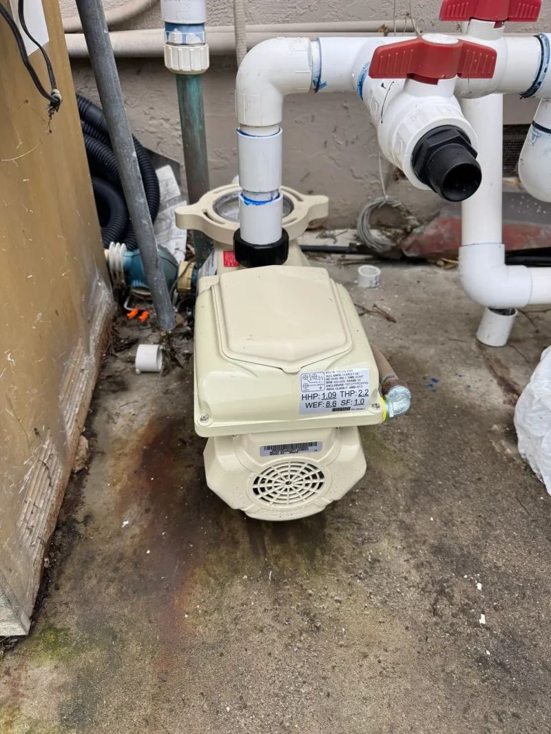 Variable-speed pool pump on a Lake Havasu City equipment pad, the kind a pool automation controller runs, JM Pool Service